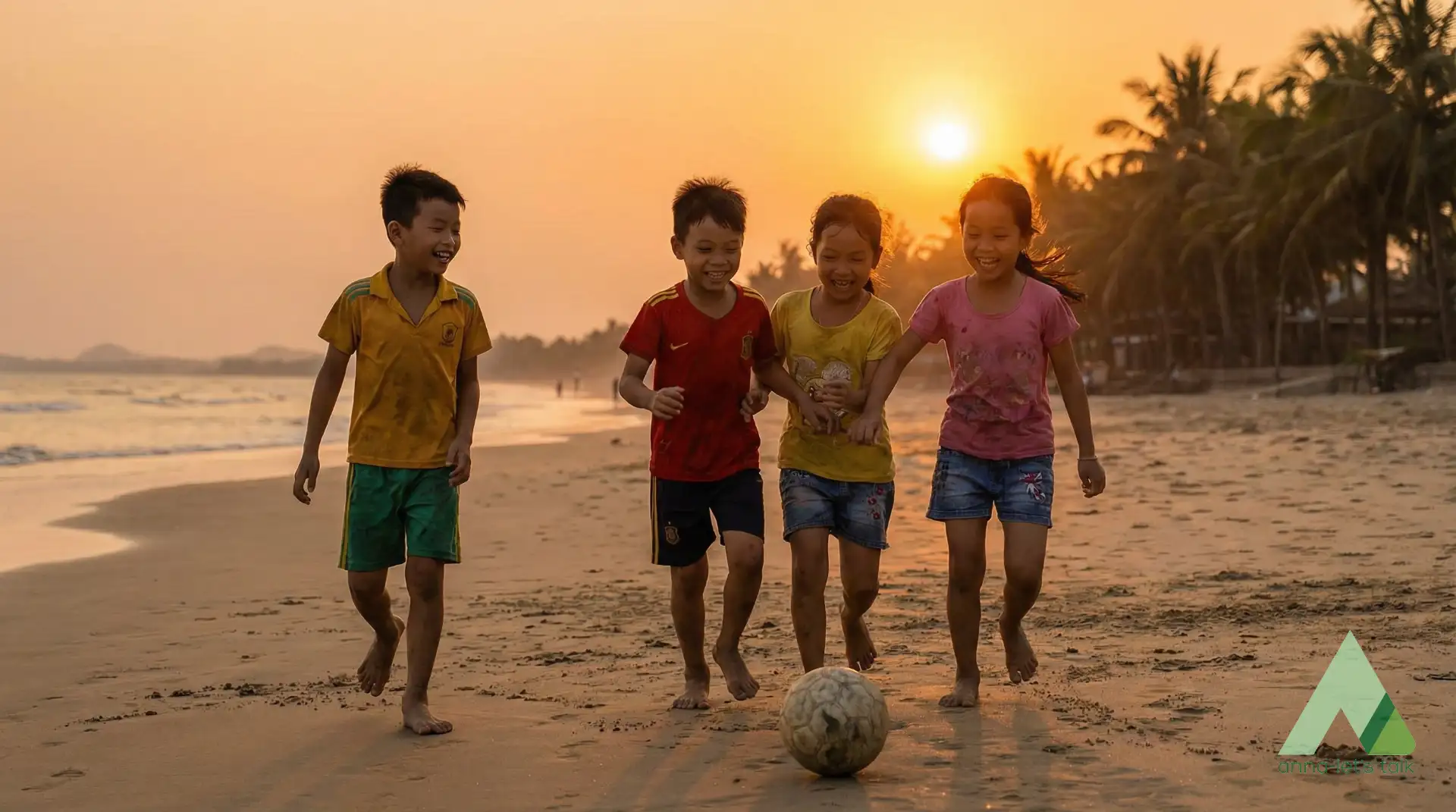 Kids playing football on the beach at sunset in Nha Trang